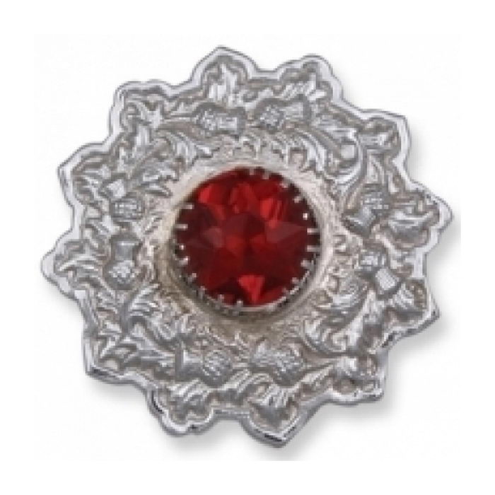 A Plaid Brooch Featuring An Embossed Thistle Design Red Stone
